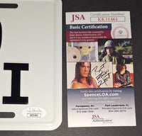 Daphne Zuniga autographed license plate